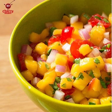 Vibrant maraschino cherry mango salsa.  