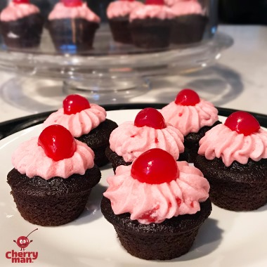 Cherry cupcake topped with buttercream frosting