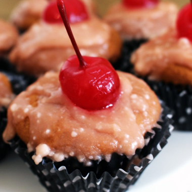 A stack of chocolate cherry cookies served with cold milk. 