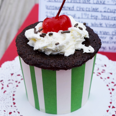 Single chocolate cherry bomb served on white plate