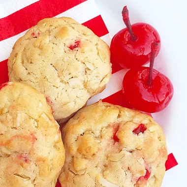 Coconut cookies with tasty bright red cherries