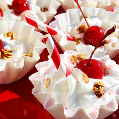 Single chocolate cherry bomb served on white plate