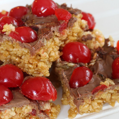 A stack of chocolate cherry cookies served with cold milk. 